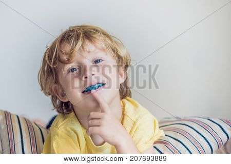 Three-year Old Boy Shows Myofunctional Trainer To Illuminate Mouth Breathing Habit. Helps Equalize T