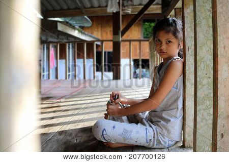 Asian girls in the local house balcony in Thailand.