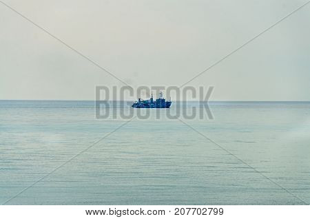 Boat or ship navigating on blue Black Sea water cargoboat.