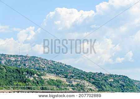 The Black Sea Shore, Green Hills With Houses, Blue Clouds Sky. City Balchik Coast