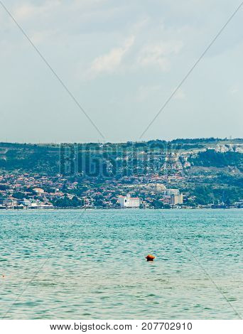 The Black Sea Shore, Green Hills With Houses, Blue Clouds Sky. City Balchik Coast