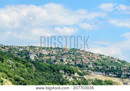 The Black Sea Shore, Green Hills With Houses, Blue Clouds Sky. City Balchik Coast