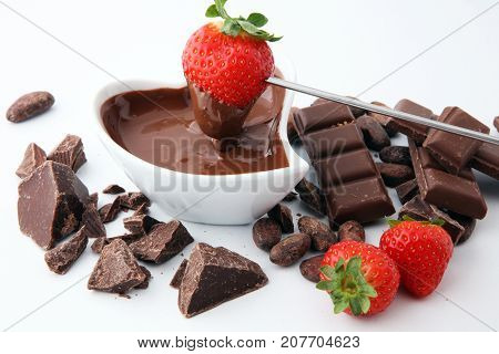 Fondue with Melting chocolate or melted chocolate and strawberry.