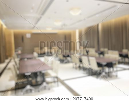 Blurred Image Of Empty Interior Of Conference Room, Meeting Room Prepare For Webinar. Blurry Nobody