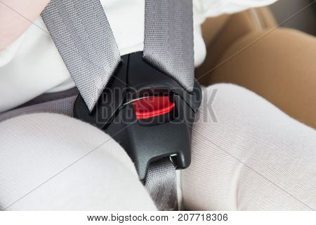 Child In A Baby Car Seat. Isofix Clamping. Beige Car Seat In A Bright Salon
