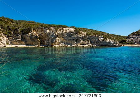 Landscape of Corsica nature sea and mountains. Travels with boat to near city.