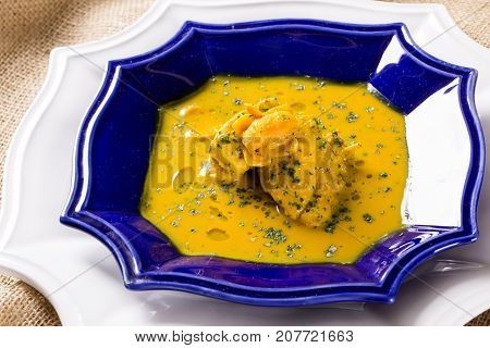 Pequi Fruit With Chicken Over A Wooden Table. Frango Com Pequi.