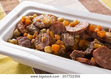 South American Cuisine: Puchero Soup With Sausage. Close-up In A Pot On The Table.