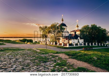 Church of St Constantine and Helena on rural island Sviyazhsk in Russia. Summer Sunset.