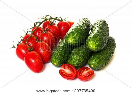 vegetables cucumbers and tomatoes on a white background
