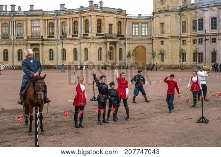 Gatchina St. Petersburg Russia - September 30 2017: Horse show of Cossacks on the parade ground of the Gatchina Palace. Young Cossacks greet the audience after the performance.