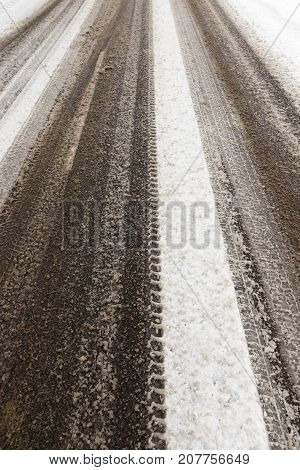 Tracks In The Snow Driven By Cars In The Winter Season