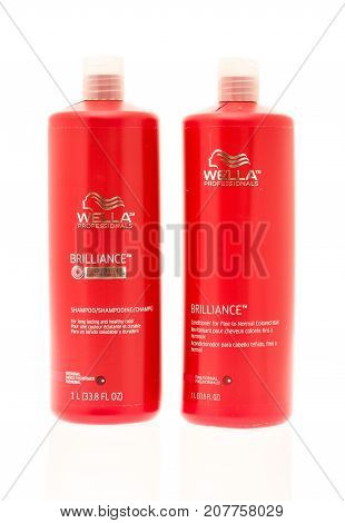 Winneconne WI - 29 September 2017: Bottles of Wella shampoo and conditioner on an isolated background.