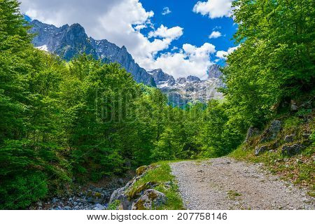 In The Mountains Lies A Winding Rocky Road.