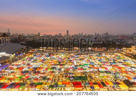 Top view city downtown flea market with sunset over business area background
