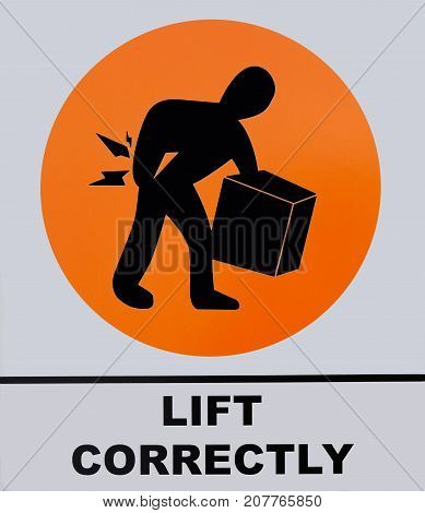 Photo of Lift Correctly sign isolated on white background. This photo was taken from the sign board.