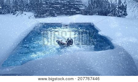 Swimming in pool during winter. Imege of surreal