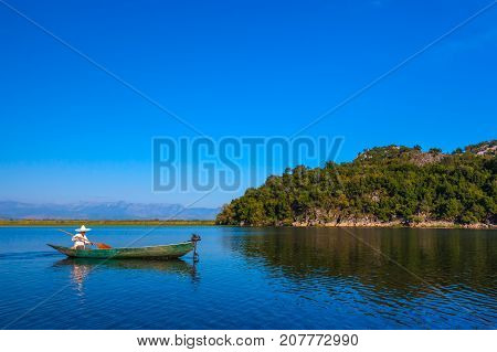 A fisherman's boat with a motor on Lake Skadar. Montenegro. Photo taken at Skadar Lake Podgorica region.