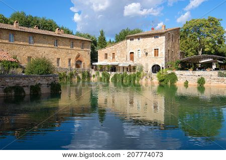 A sunny day by the ancient thermal pool in Bagno Vignoni. Tuscany, Italy