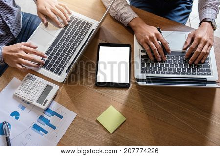 Business team meeting working with new startup project discussion and analysis data the charts and graphs. Digital tablet calculator laptop computer using Business finance and accounting concept.