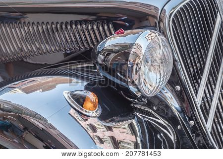 Headlight and intermittent detail in a classic black car