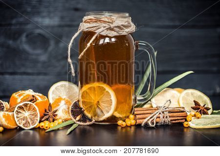 The Composition Of Tea With Lemon On A Black Background