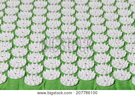 Acupuncture mat for treatment in orthopedics. For the spine
