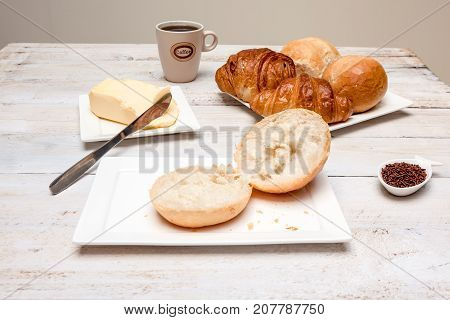 an Hard roll call it in Dutch Pistolee and croissant whit knife and butter