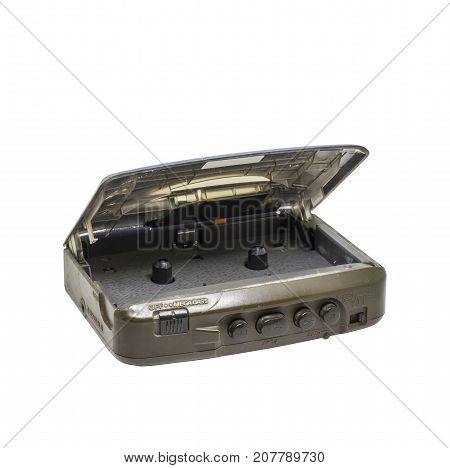 Old portable audio player or audio cassette tape isolated on white background. Retro handy cassette tape player.