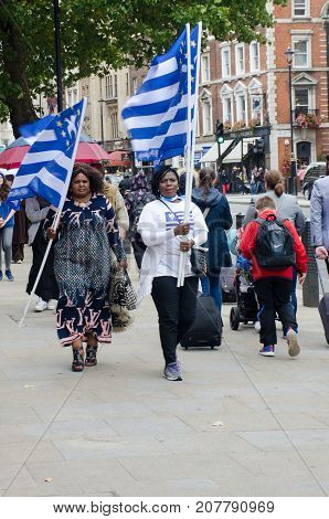 London United Kingdom -1 October 2017: Southern Cameroon protesters with flag in London