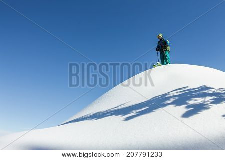 Man Skier Freerider Standing At Top Of Ridge, Adventure Winter Freeride Extreme Sport