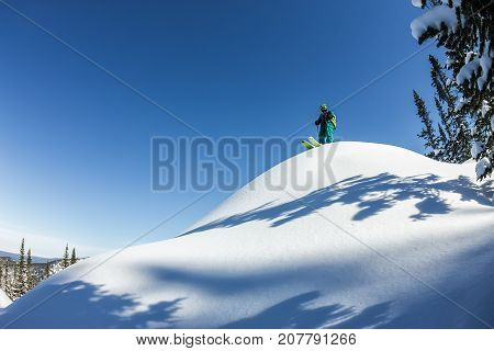 Man Skier Freerider Standing At Top Of Ridge, Adventure Winter Freeride Extreme Sport