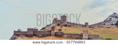 Genoese fortress in Sudak, the Crimea Peninsula, Black sea. Consular castle and the fortification wall of the upper tier. Part of the wall, Museum-reserve 