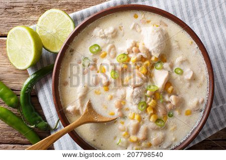 White Chili Chicken With Cannellini Beans And Corn Close-up In A Bowl. Horizontal Top View