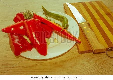 Red bell pepper backgro and Green Peppers. Fresh organic vegetables on table. Green and red bell pepper backgro. Fresh raw vegetables on the table - Retro color