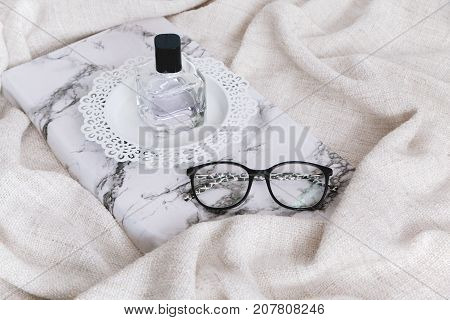 Perfumery On Wooden Stand And Glasses