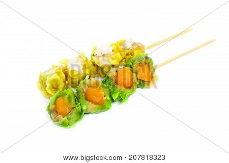 Close up yellow crab-filled & green salted egg pork-filled chinese steamed dumpling or dim sum isolated on white background - food chinese concept.