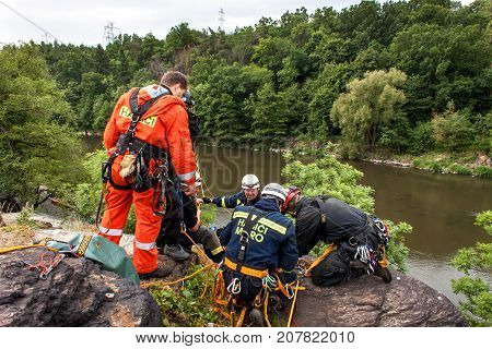 Kadan Czech Republic June 6 2012: Exercise rescue units. Training rescue people in inaccessible terrain at the dam Kadan. Recovery using rope techniques