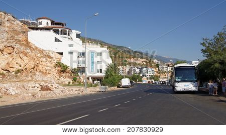 Finike;Turkey-September 08;2017: Otel Carpe Diem Gold.At the parking lot are cars. People stand at the bus stop