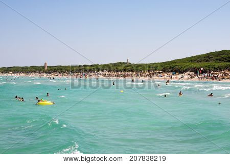 Alcudia, Majorca, Balearic islands, July 2017: Tourist on holidays at Playa de Muro beach with Alcudia pins in background northern part of the island