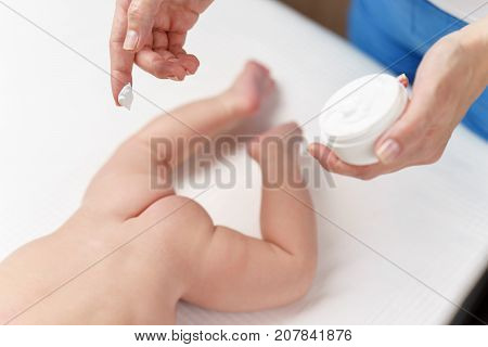 Mom Applying Some Cream By Her Hand To The Babby Ass