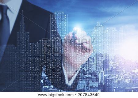 Businessman drawing abstract circuit board city. Engineering concept. Double exposure