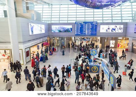 February 21 2016: South Korea Incheon International Airport. Passengers watch and take a photo Korean national concert historical costume parade of royal family of the Joseon dynasty . Top view
