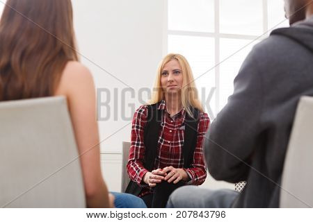 Meeting of support group. Happy woman talking about her life, everything good. Mental health, psychotherapy concept
