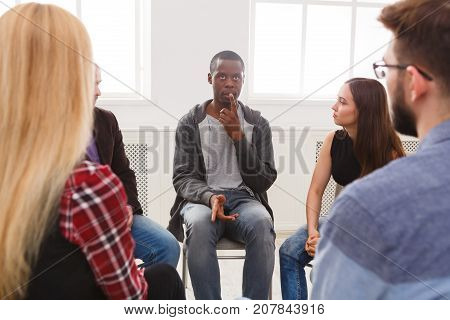 Meeting of support group. African-american man talking about his life, telling his problems and issues. Mental health, psychotherapy concept