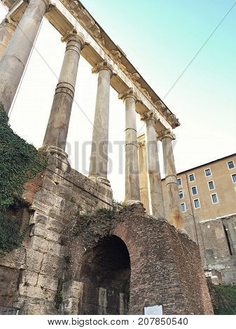 Ruins in Rome in sunlight with blue sky
