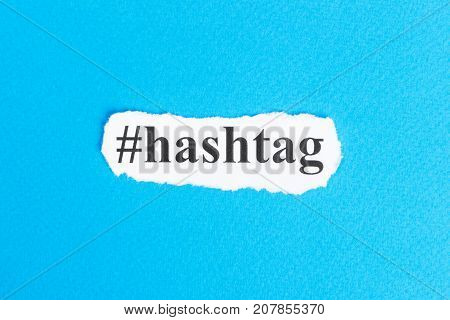 Hashtag text on paper. Word Hashtag on torn paper. Concept Image.