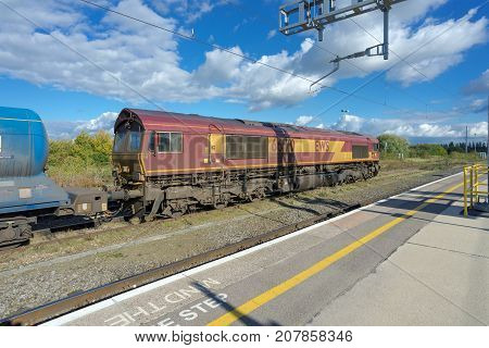 Didcot, UK. 8th October 2017. A freight train with tanks is idle in a siding at Didcot Parkway railway station.