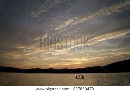 Interesting sunset with clouds over Squam Lake, New Hampshire