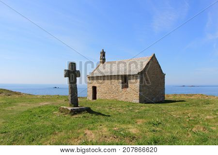 Saint Samson chapel and cross near the sea in Landunvez